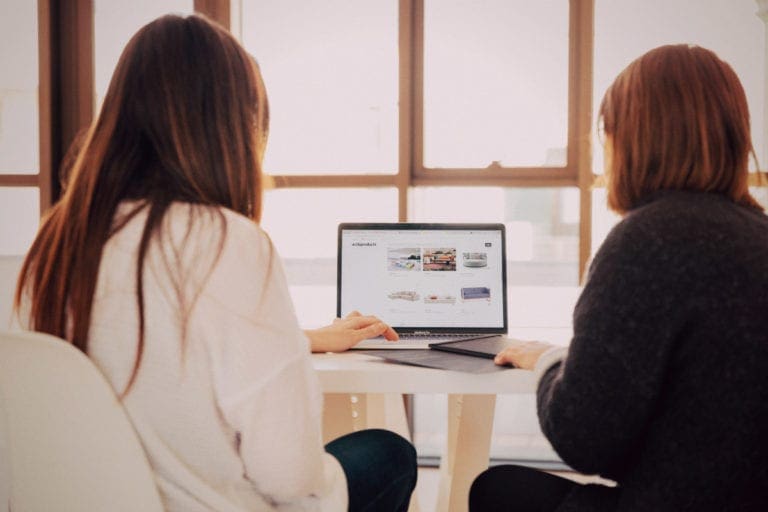 Two women at laptop