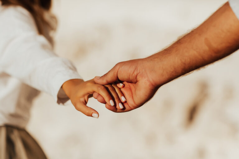 Couple holding hands