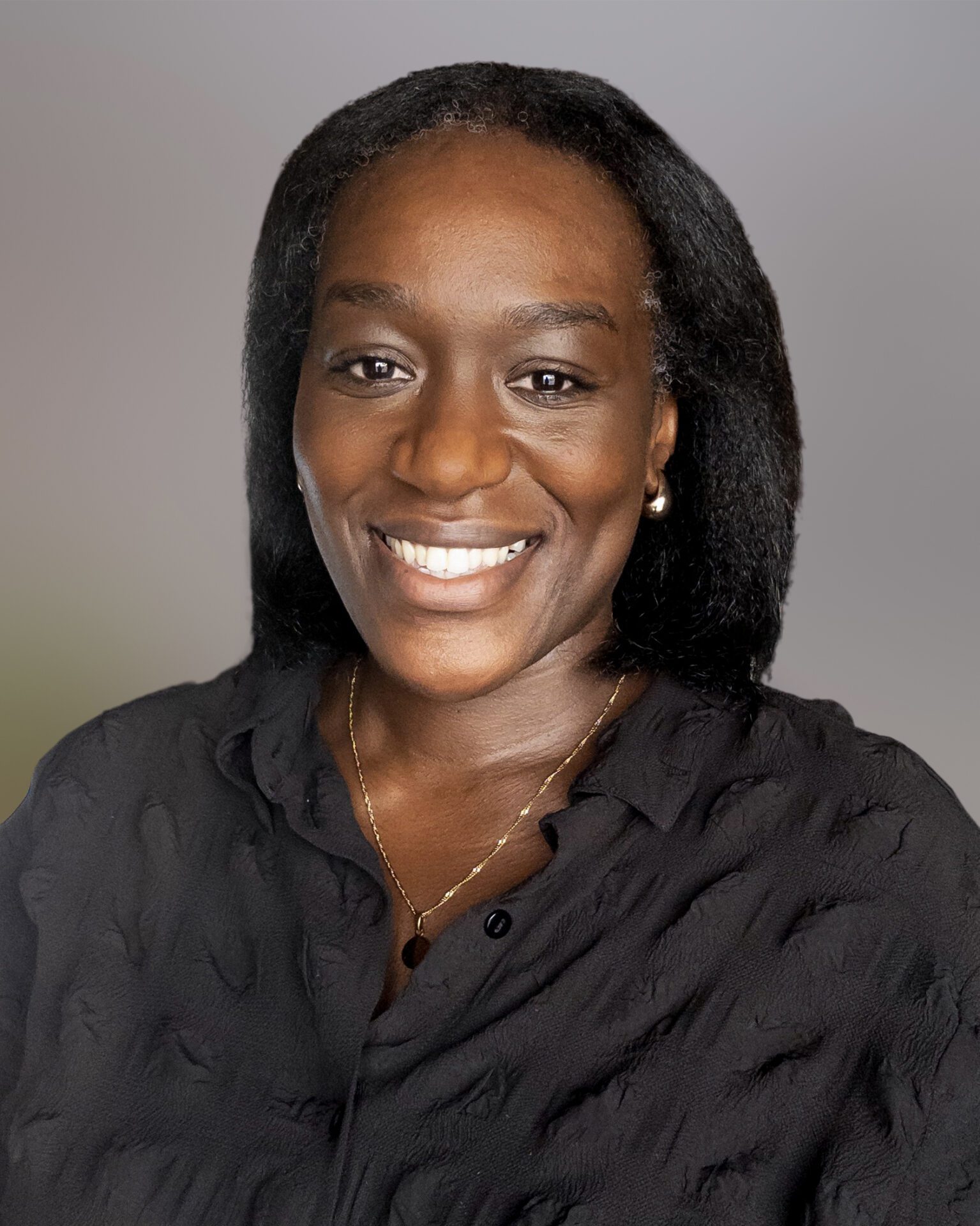 Headshot of Lotus Kimona, Family Lawyer at Stowe Family Law, wearing a black top